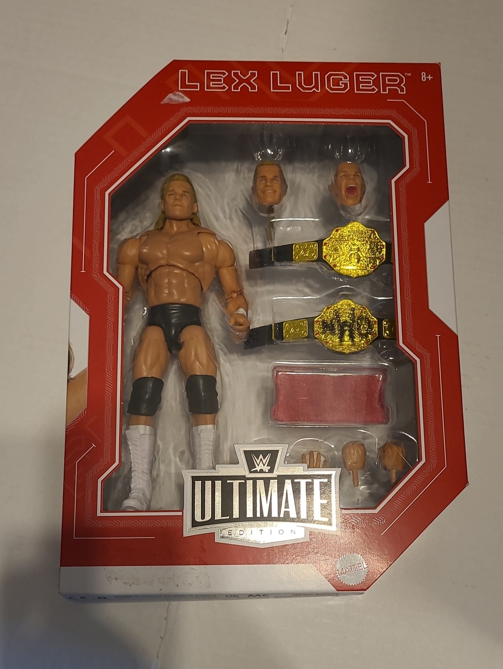 WWE Lex Luger Action Figure with Gold Belts in Red Packaging